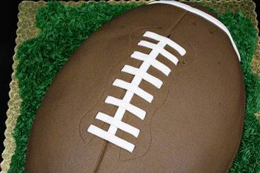 Giant football-shaped groom's cake.