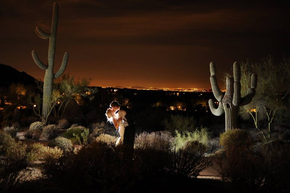 The newlywed kiss among the cacti