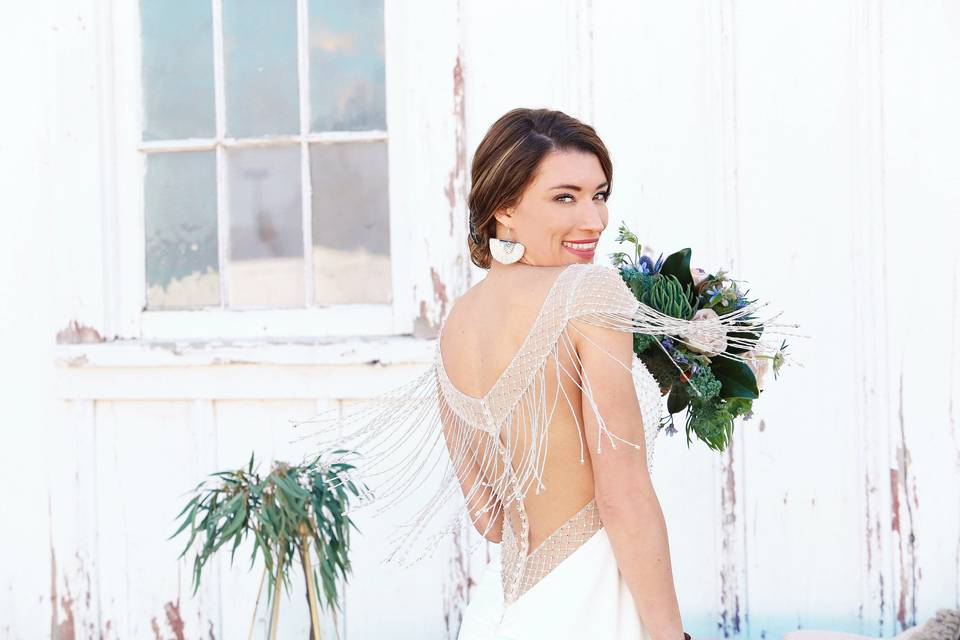 Bride posing with her bouquet