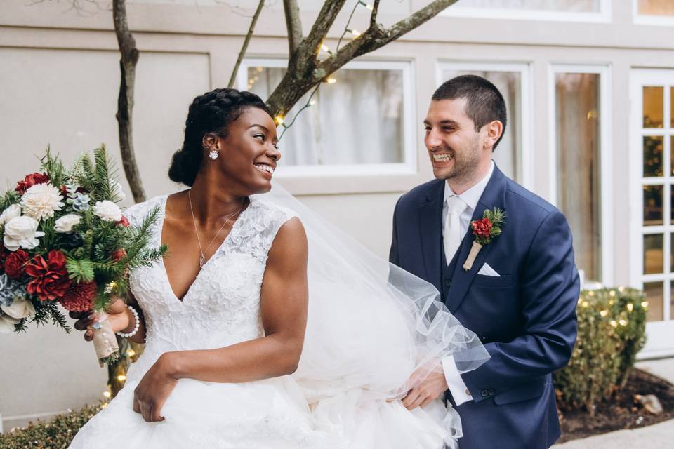 Groom carrying dress