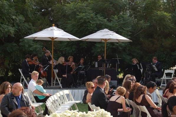Our 9 piece chamber ensemble with male & female vocalists playing during a wedding prelude at the St. Regis Resort in Monarch Beach, California