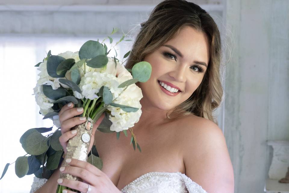 A happy bride with a bouquet