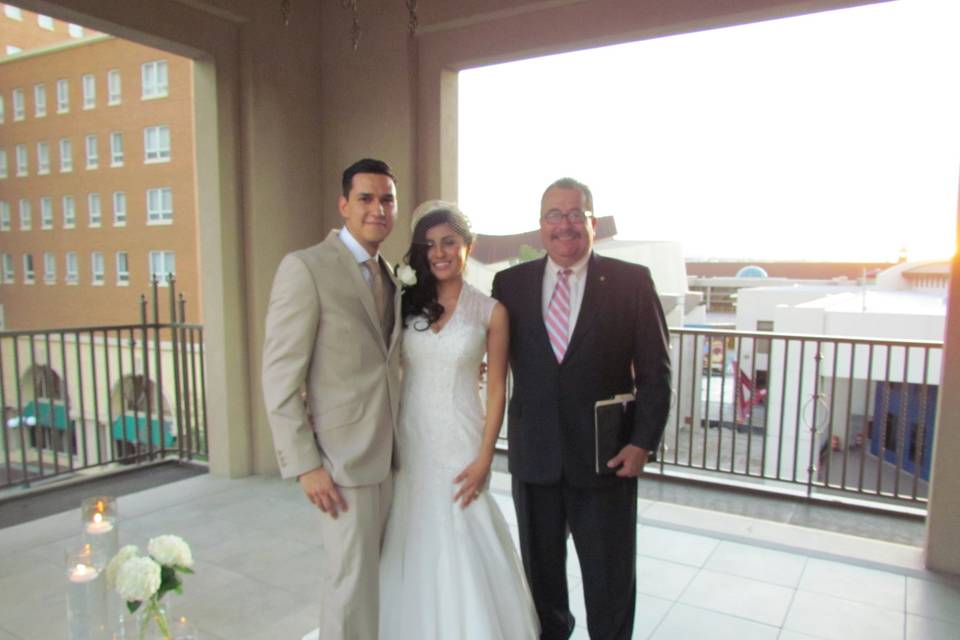 Newlyweds with the officiant