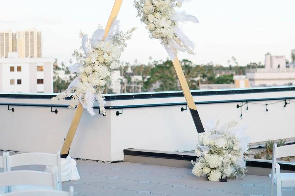 Double arch ceremony florals