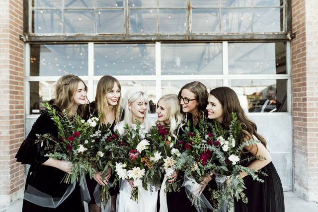 Bridal party in front of garag