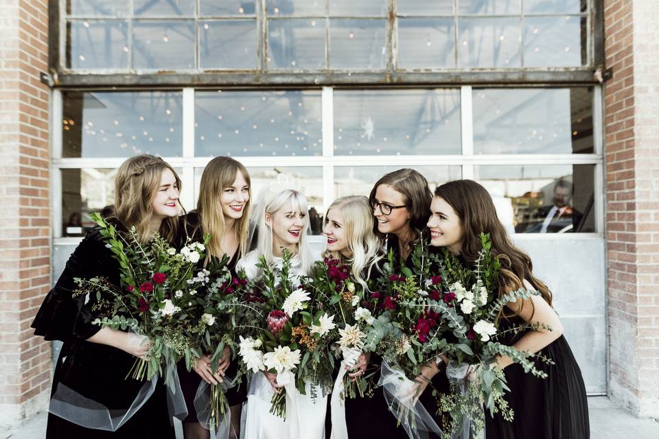Bridal party in front of garag