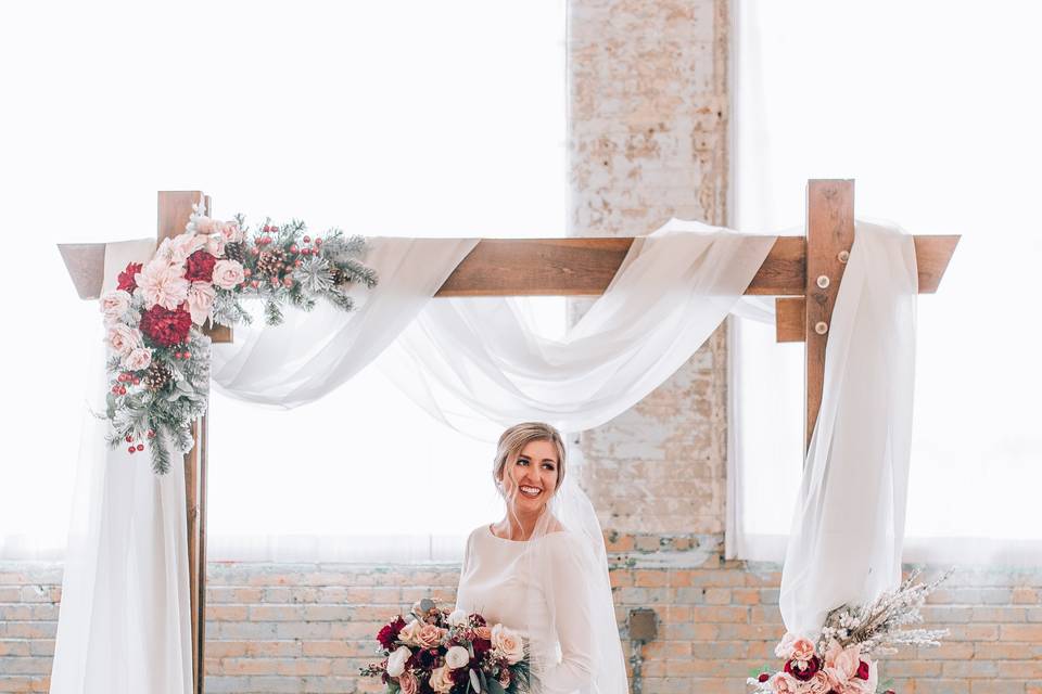 Bride under a decorated arch