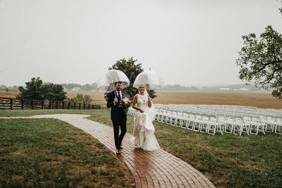 Newlyweds with their umbrellas