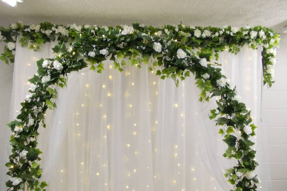 White flower backdrop and arch