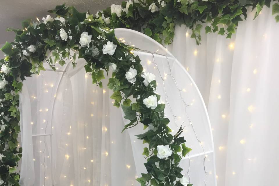 White flower arch and backdrop