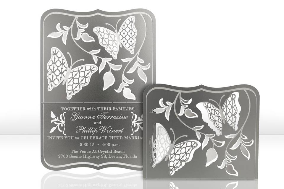 The FLUTTER metal invitation… two butterflies flutter about leafy vines to create this serene invitation. Mails flat and is folded into a sculpture by guests. Folding the wings and curling the leaves will bring depth to the invitation. Place a tea light behind the sculpture and watch the shadows dance! FLUTTER is also available as a favor with slits into which an escort card can be inserted.