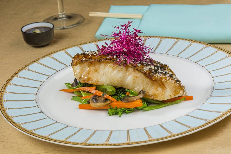 Black and white sesame-crusted szechuan glazed seabass with micro beets and stir-fried asian vegetables