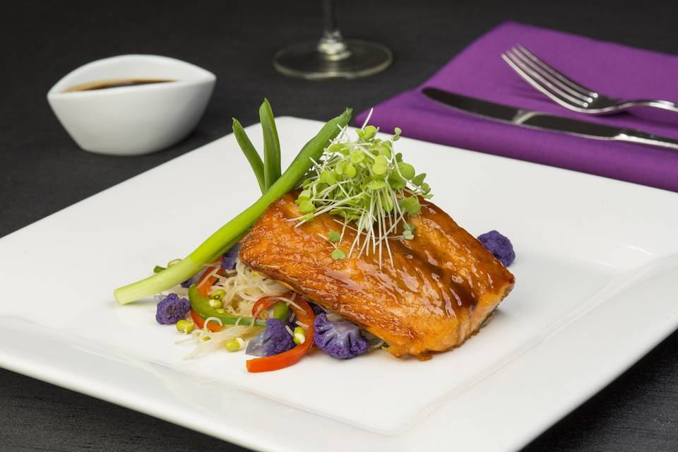 Korean barbequed salmon with rice noodles, purple cauliflower and micro greens