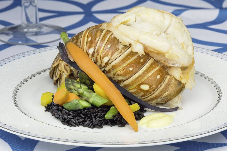 Florida lobster tail with meyer lemon drawn butter, forbidden rice and spring vegetables