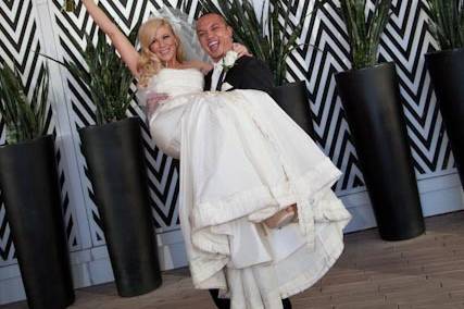 The groom carrying his bride