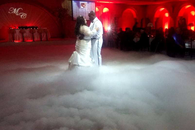 Newlyweds dancing on clouds