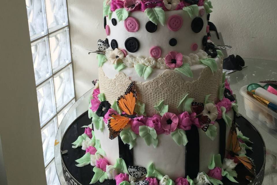 quinceanero cake with sugarpaste flowers and butterflys