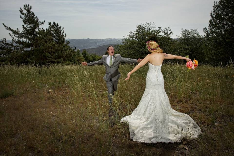 Groom and bride in field