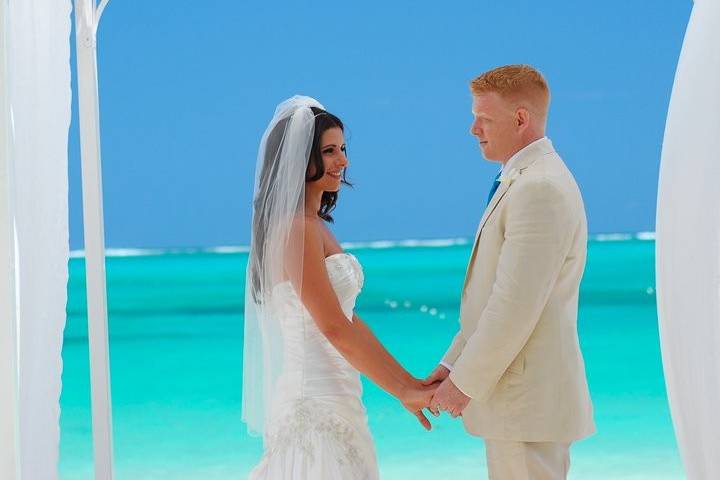 Shane & Darlene, our destination wedding clients, exchanging their vows on the beach at Beaches Turks & Caicos.