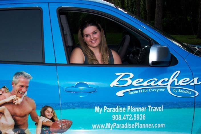 Our Owner & Founder, Kira Solomon, in our Sandals & Beaches wrapped company car.