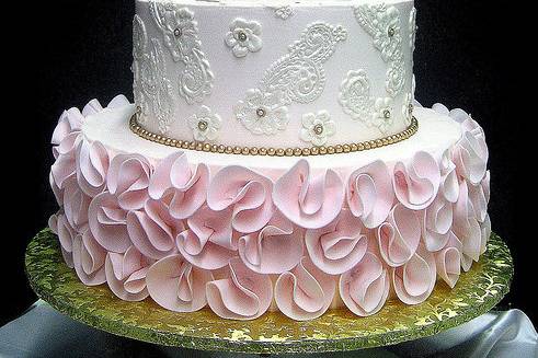 Wedding cake with pink flowers at the bottom