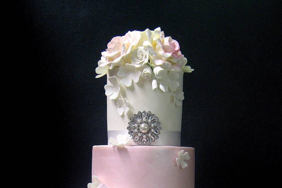 White wedding cake with a pink layer