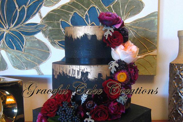 Navy blue wedding cake with gold bits