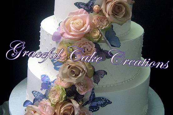 White wedding cake with summer flowers