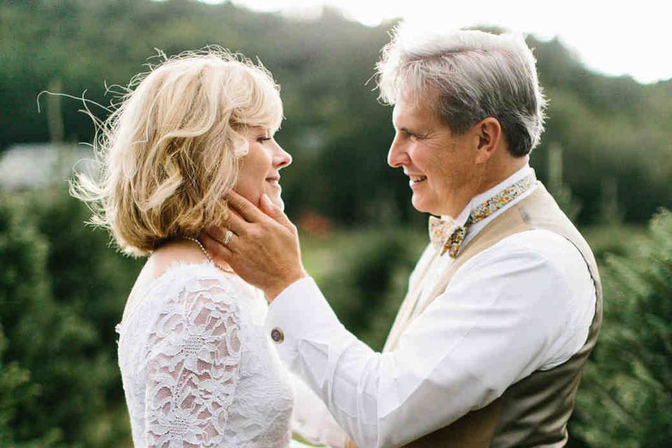 Holding his bride's face