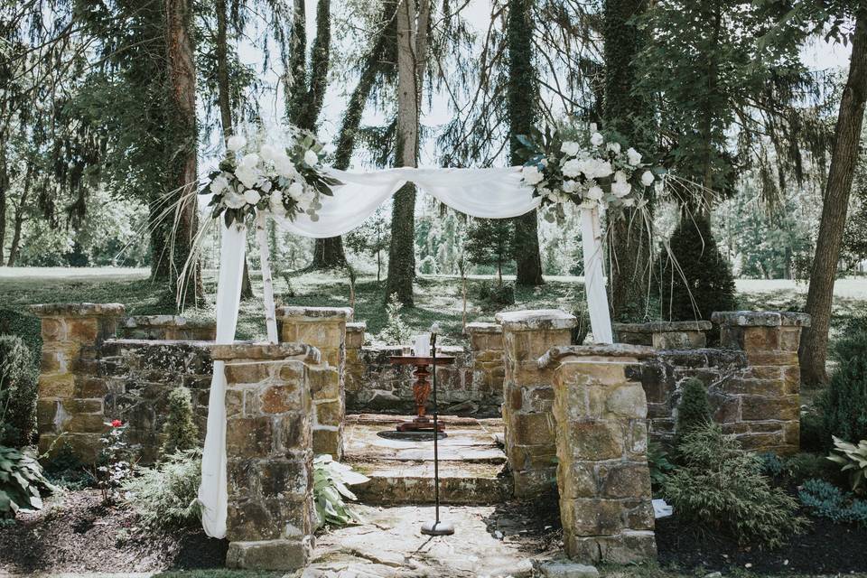 Outdoor wedding arbor setup