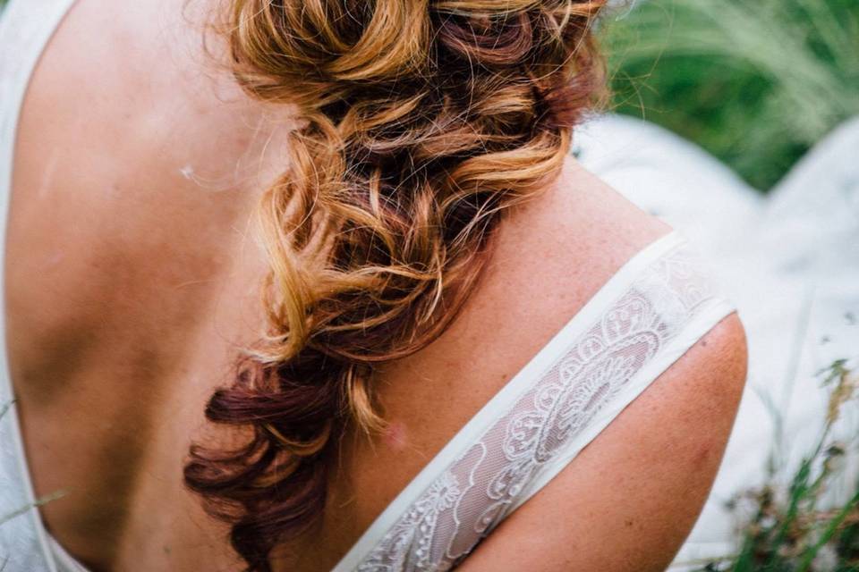 Braided wedding hair with accessory