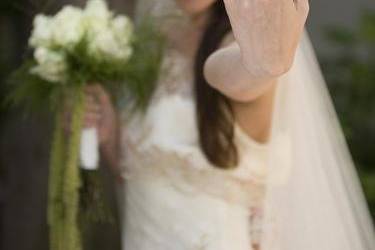 Bride showing off her beautiful wedding ring.