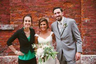 Couple with wedding officiant