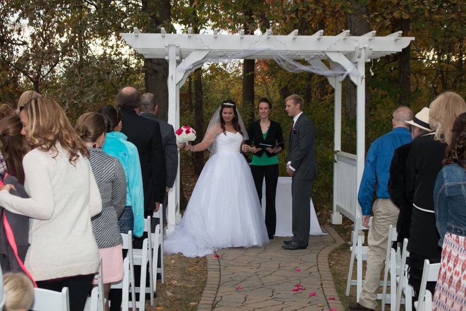 Newlyweds with wedding officiant