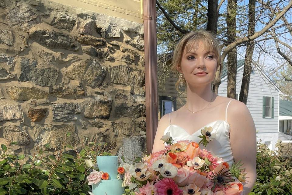 Gorgeous bride next to cake