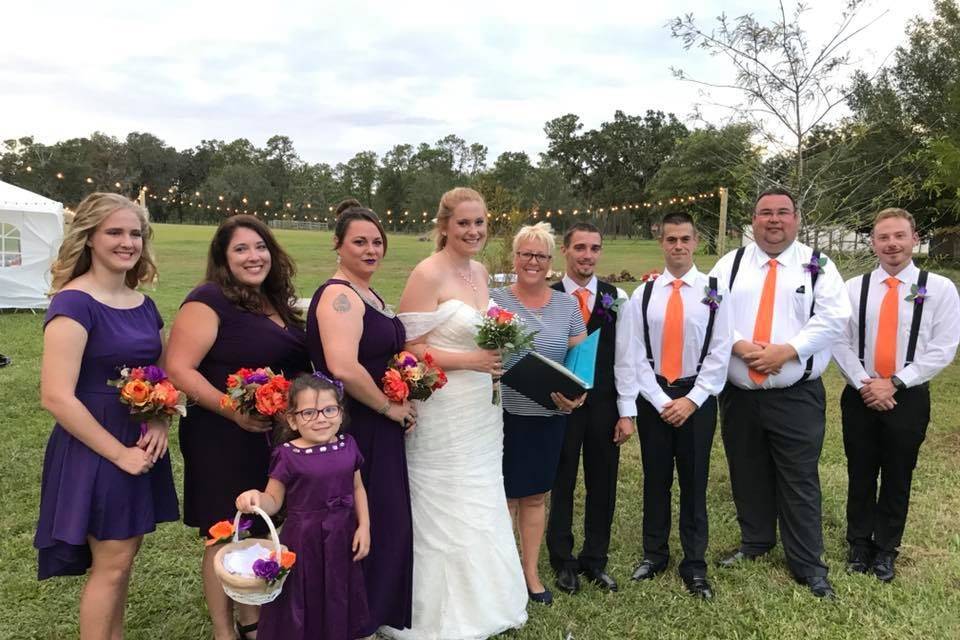 Newlyweds, guests, and officiant