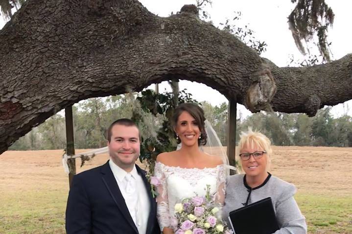 Newlyweds and the officiant