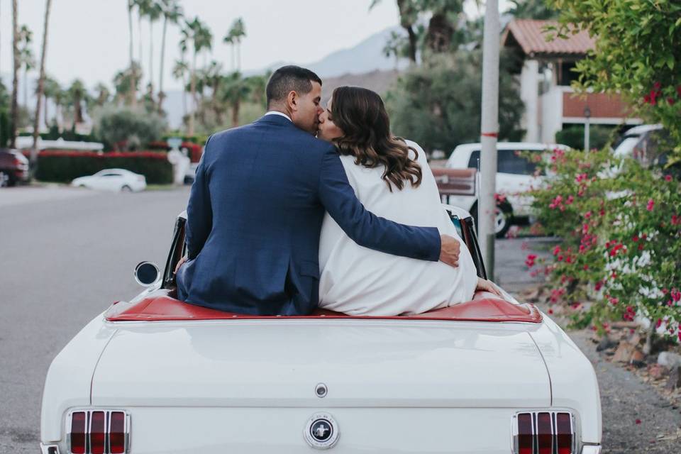 Kissing on the convertible | Photo Credit: Jenny Smith & Co.