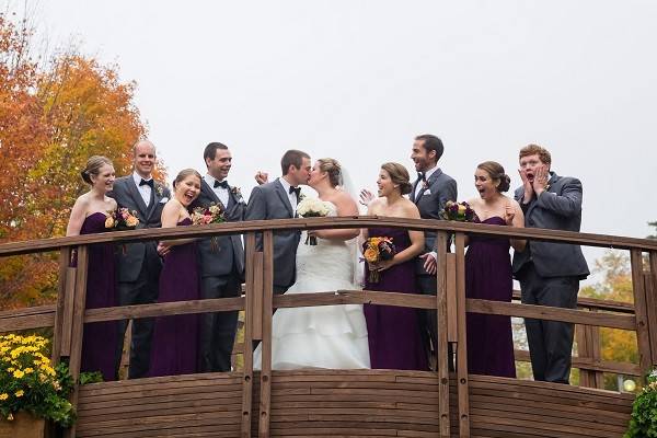 The couple with their groomsman and bridesmaids