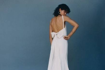 Backless dress with a bow