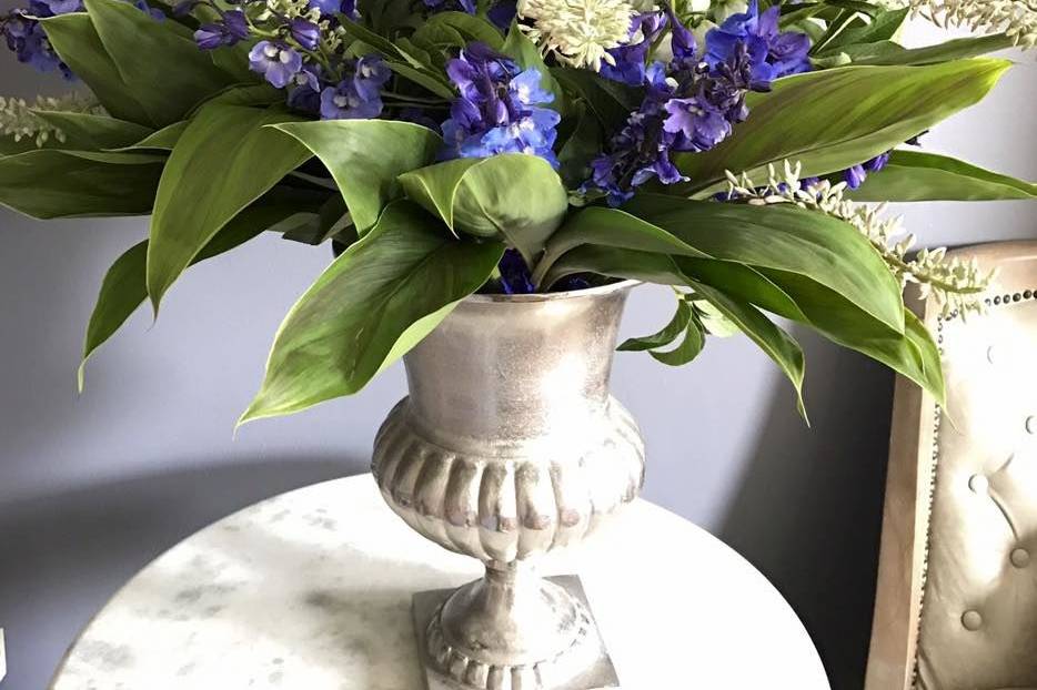 Large centerpiece with native greenery and flowers.