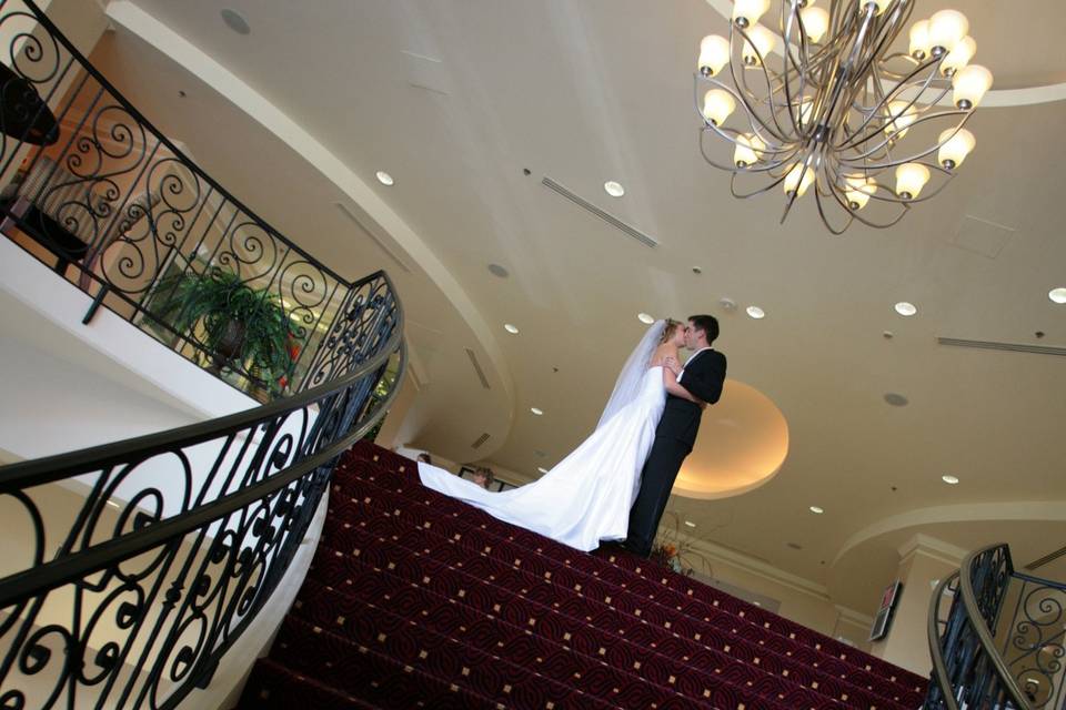Grand stairway from hotel lobby makes a great entrance for the bride and groom