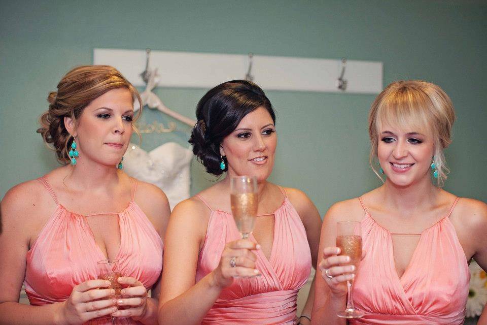 Bridesmaids drinking champagne