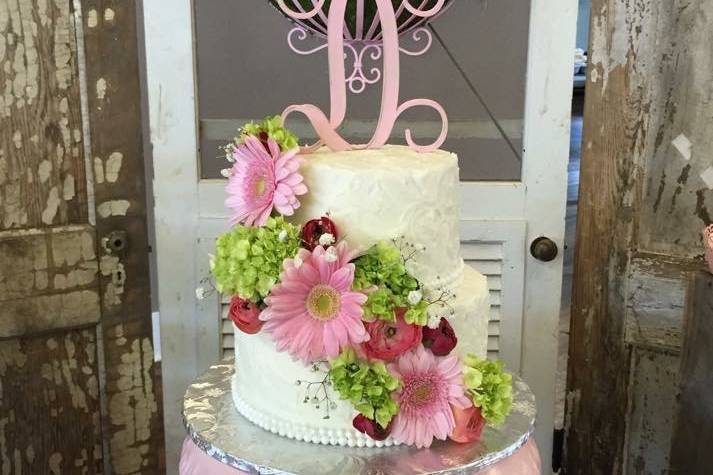 White cake with pink flowers