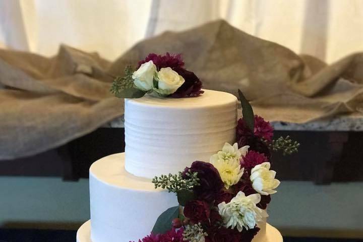 Three-layer white cake with flowers
