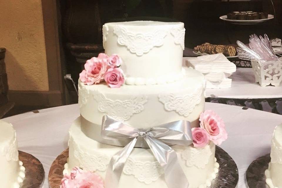 Cake with ribbon and flowers