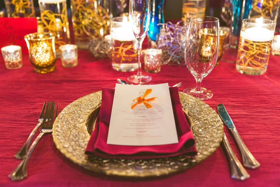 Gold cutlery and red decor