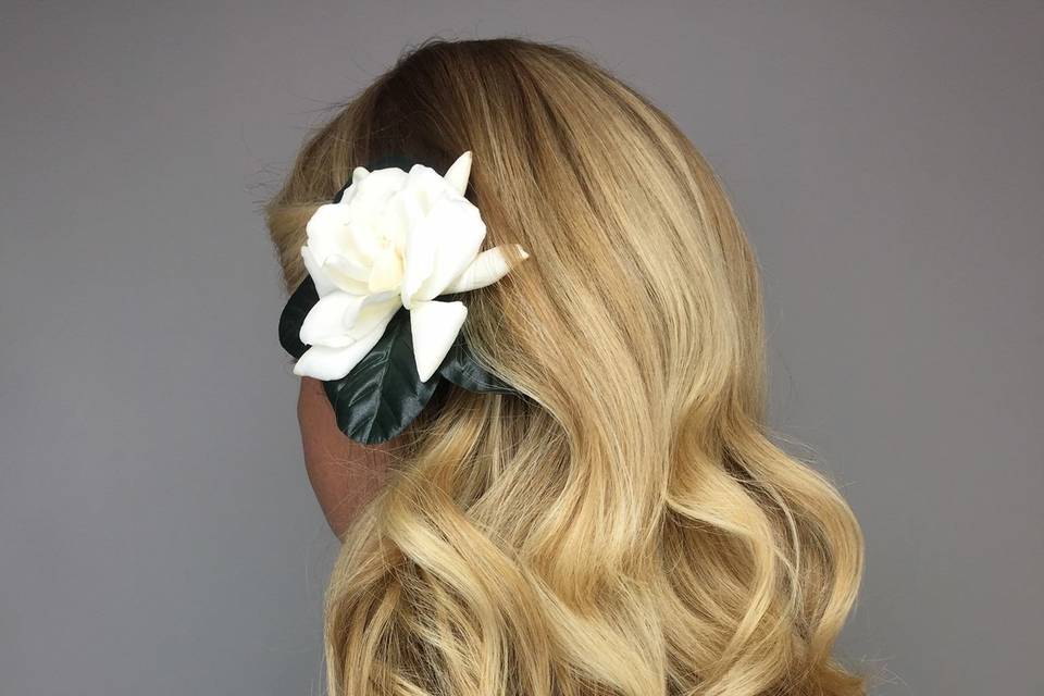 Blonde curls and flower pin