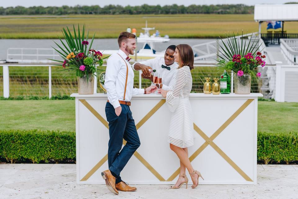 Couple standing in front of bar