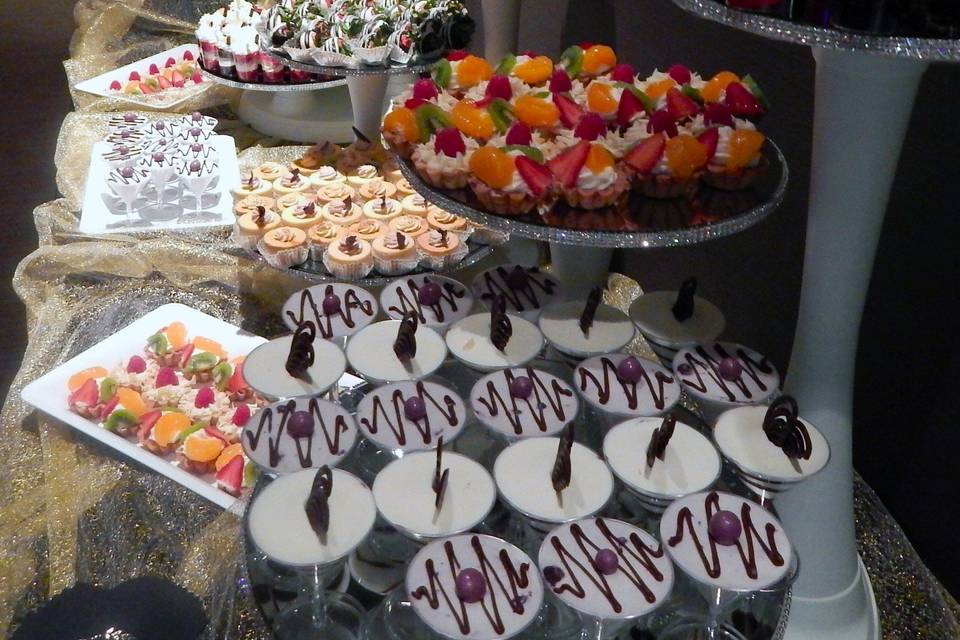 Mini Dessert Buffet Set up with Mousse martinis, Mini shooters, fruit tarts, mini cheesecakes and more!